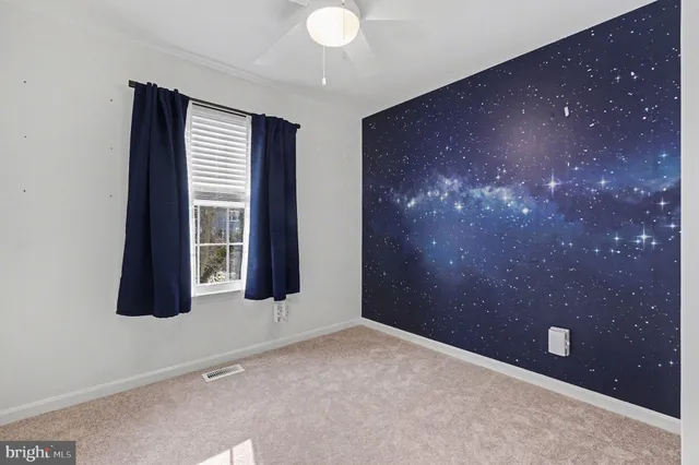 wooden floor and window in an empty room