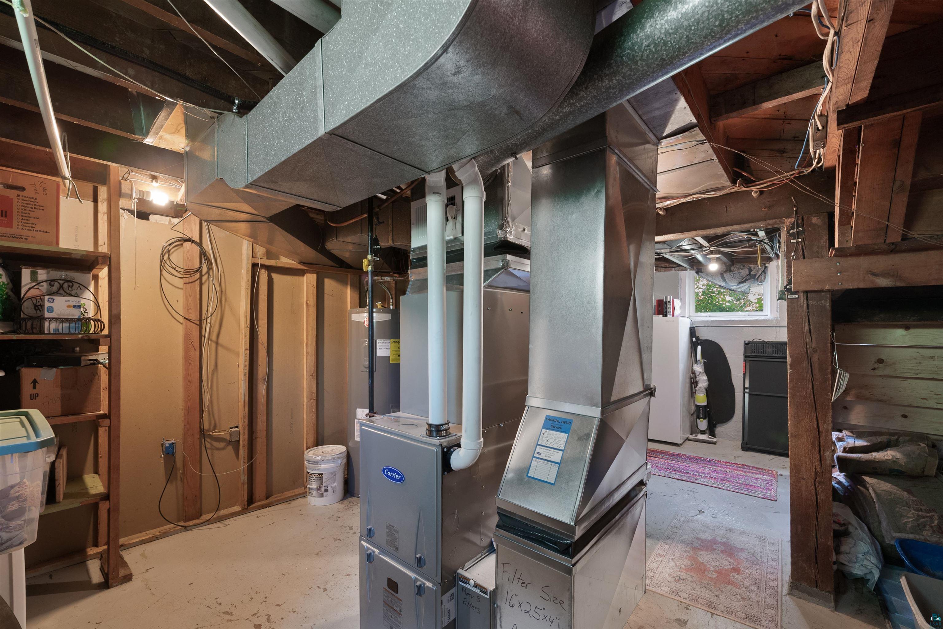 3209 Chestnut Street Duluth, MN 55806 - Photo 22 of 28 Basement utility area featuring a furnace, water heater, exposed wood joists, and ductwork