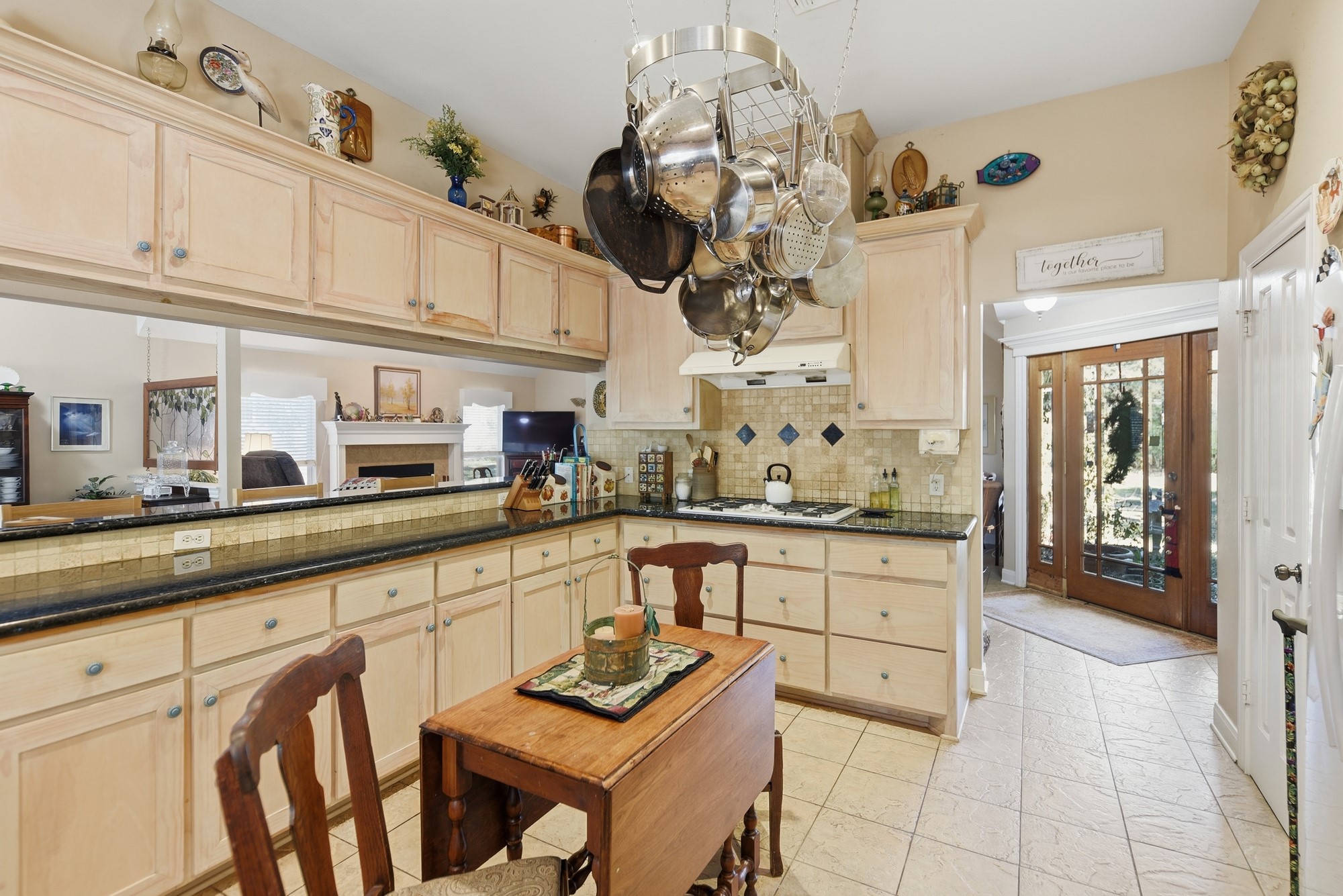 1298 Oil Patch Road New Ulm, TX 78950 - Photo 14 of 27 a kitchen with stainless steel appliances granite countertop a sink and cabinets
