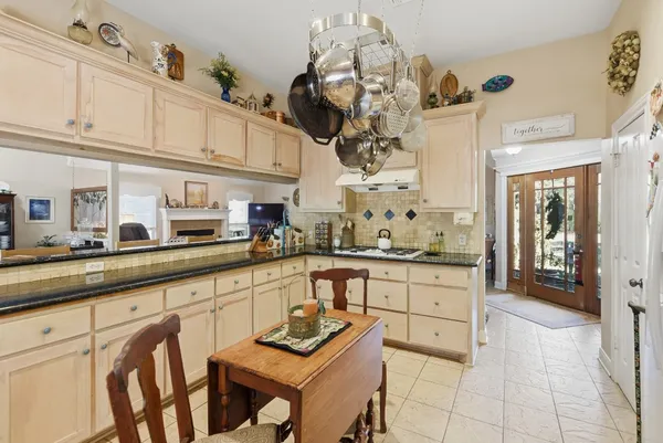 a kitchen with stainless steel appliances a sink and cabinets
