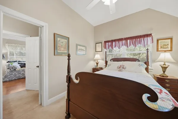a bedroom with a bed and cabinets