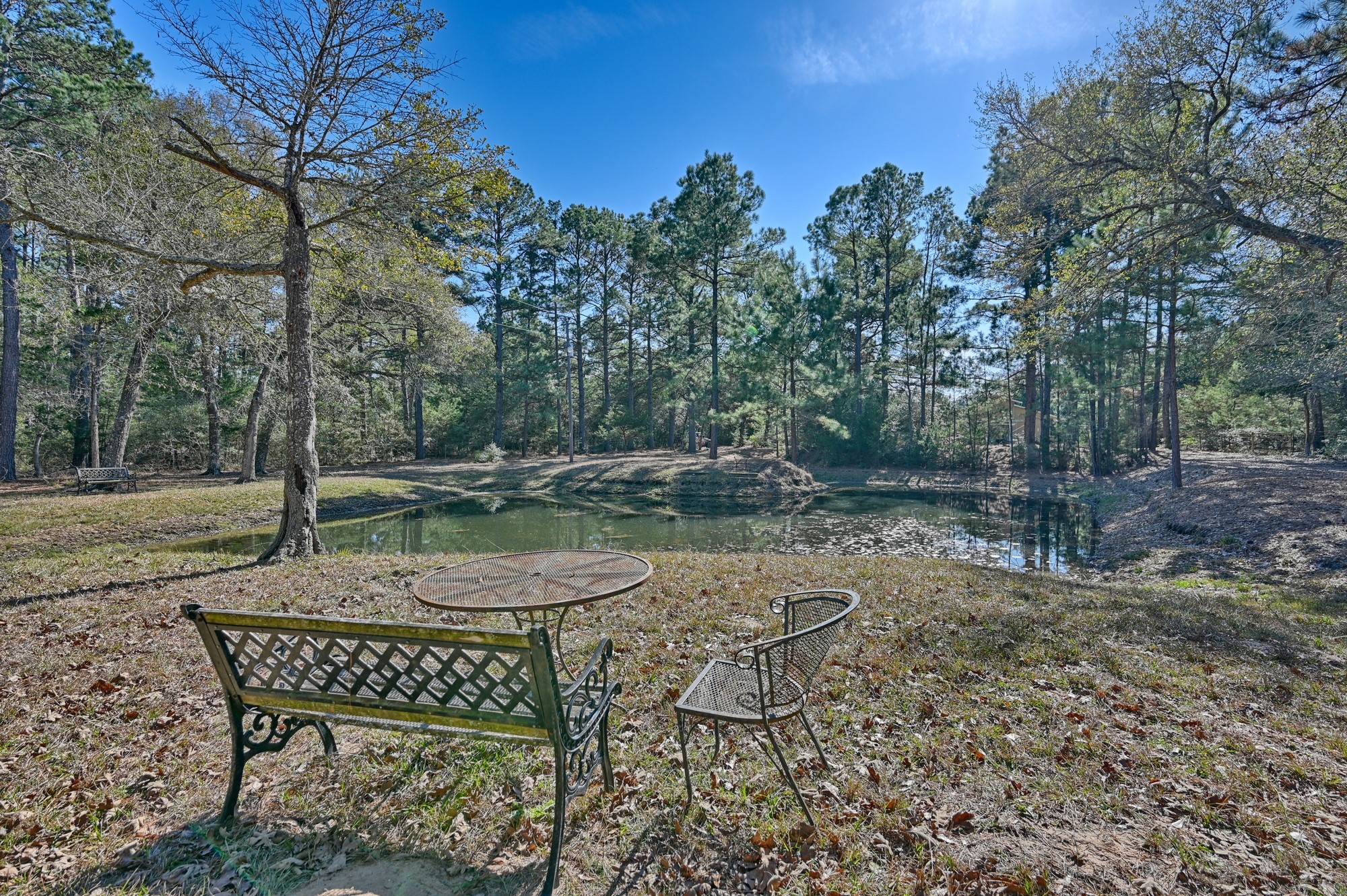 1298 Oil Patch Road New Ulm, TX 78950 - Photo 2 of 27 a patio with a yard table and chairs