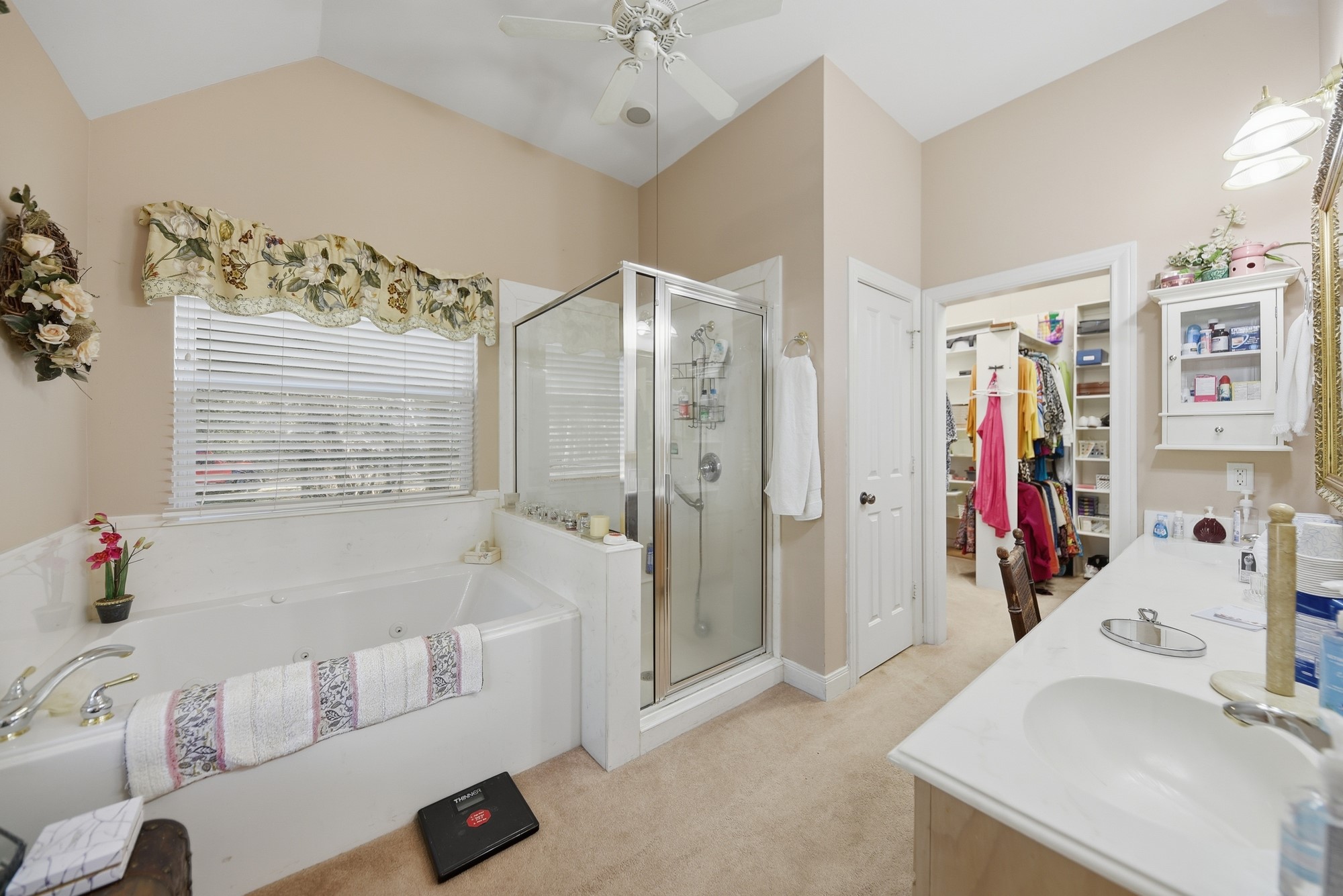 1298 Oil Patch Road New Ulm, TX 78950 - Photo 21 of 27 a bathroom with a tub sink and mirror