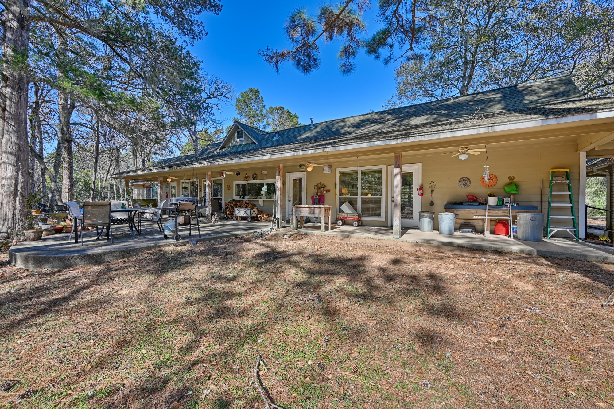 1298 Oil Patch Road New Ulm, TX 78950 - Photo 22 of 27 a view of large trees with patio