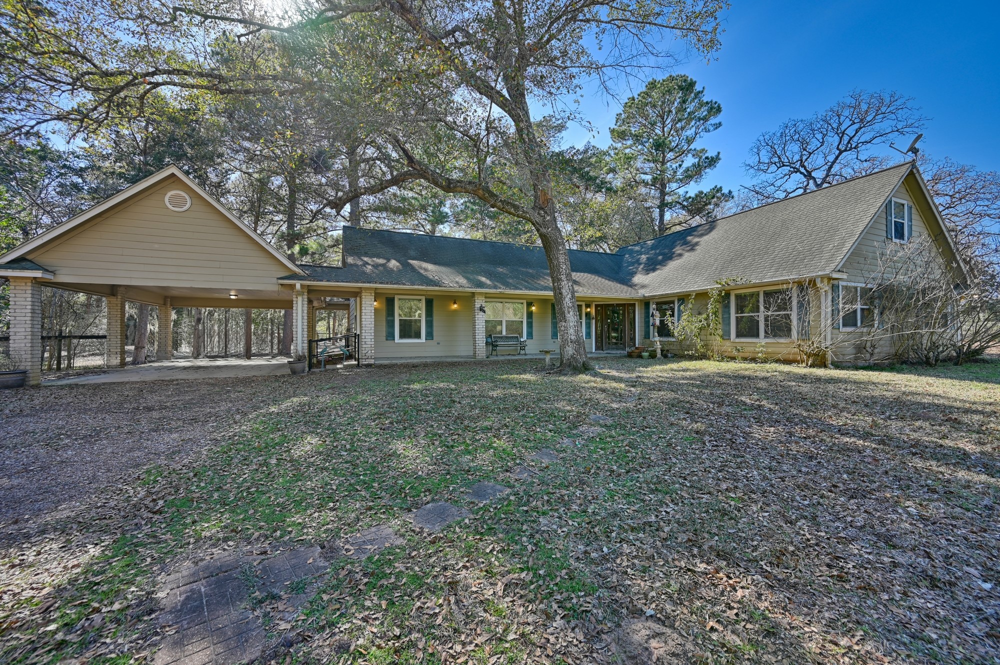 1298 Oil Patch Road New Ulm, TX 78950 - Photo 7 of 27 a front view of a house with a garden