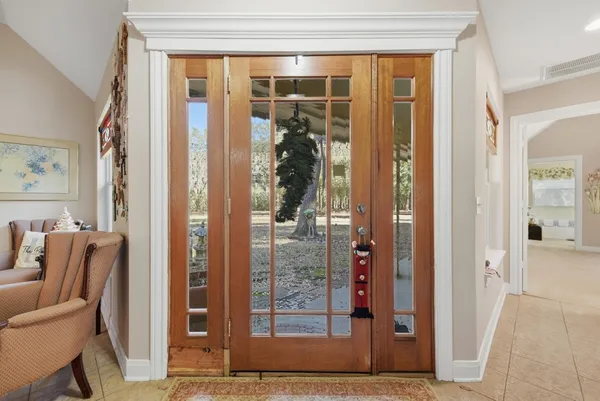 a view of a entryway door and hallway