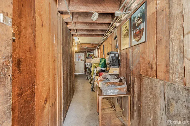 a roof deck with table and chairs