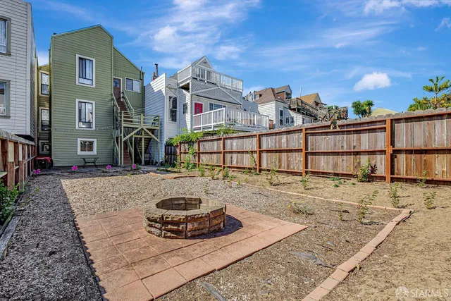 a view of a porch with a table and chairs