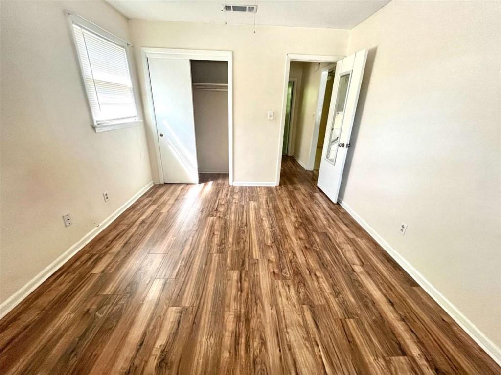 1002 Level Creek Road, Unit 201 Sugar Hill, GA 30518 - Photo 12 of 13 a view of wooden floor in an empty room
