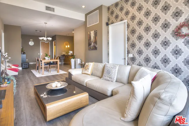 a living room with furniture and a rug