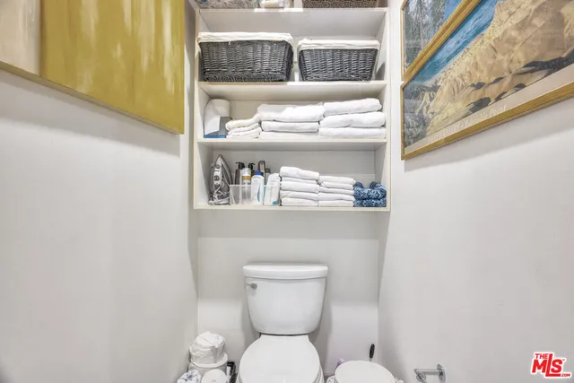 a bathroom with a toilet and a sink