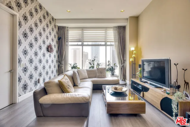 a living room with furniture and a flat screen tv