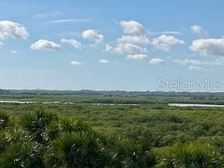 4650 Links Village Drive, Unit B503 Ponce Inlet, FL 32127 - Photo 12 of 47 a view of an ocean and beach