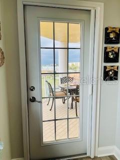 4650 Links Village Drive, Unit B503 Ponce Inlet, FL 32127 - Photo 18 of 47 view of a room with a window and bed
