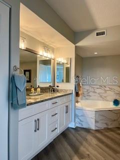 4650 Links Village Drive, Unit B503 Ponce Inlet, FL 32127 - Photo 25 of 47 a bathroom with a granite countertop sink mirror and
