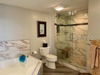 4650 Links Village Drive, Unit B503 Ponce Inlet, FL 32127 - Photo 27 of 47 a bathroom with a shower and a toilet