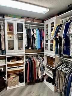 4650 Links Village Drive, Unit B503 Ponce Inlet, FL 32127 - Photo 30 of 47 a view of walk in closet with clothes and shoes