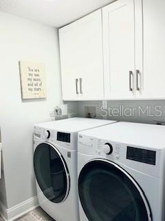 4650 Links Village Drive, Unit B503 Ponce Inlet, FL 32127 - Photo 31 of 47 a utility room with dryer and washer