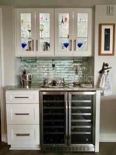 4650 Links Village Drive, Unit B503 Ponce Inlet, FL 32127 - Photo 5 of 47 a kitchen with appliances and cabinets