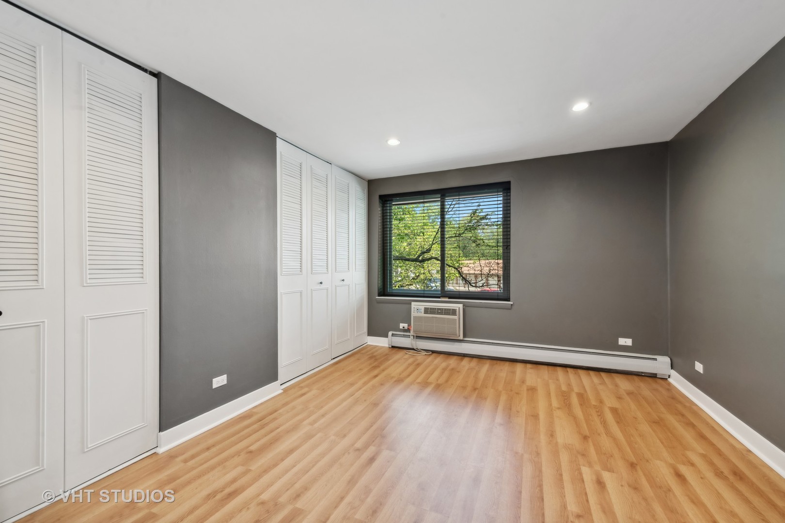 1107 South Old Wilke Road, Unit 205 Rolling Meadows, IL 60008 - Photo 11 of 19 wooden floor in an empty room with a window