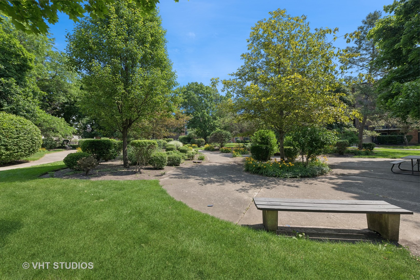 1107 South Old Wilke Road, Unit 205 Rolling Meadows, IL 60008 - Photo 16 of 19 a view of a park with plants and large trees