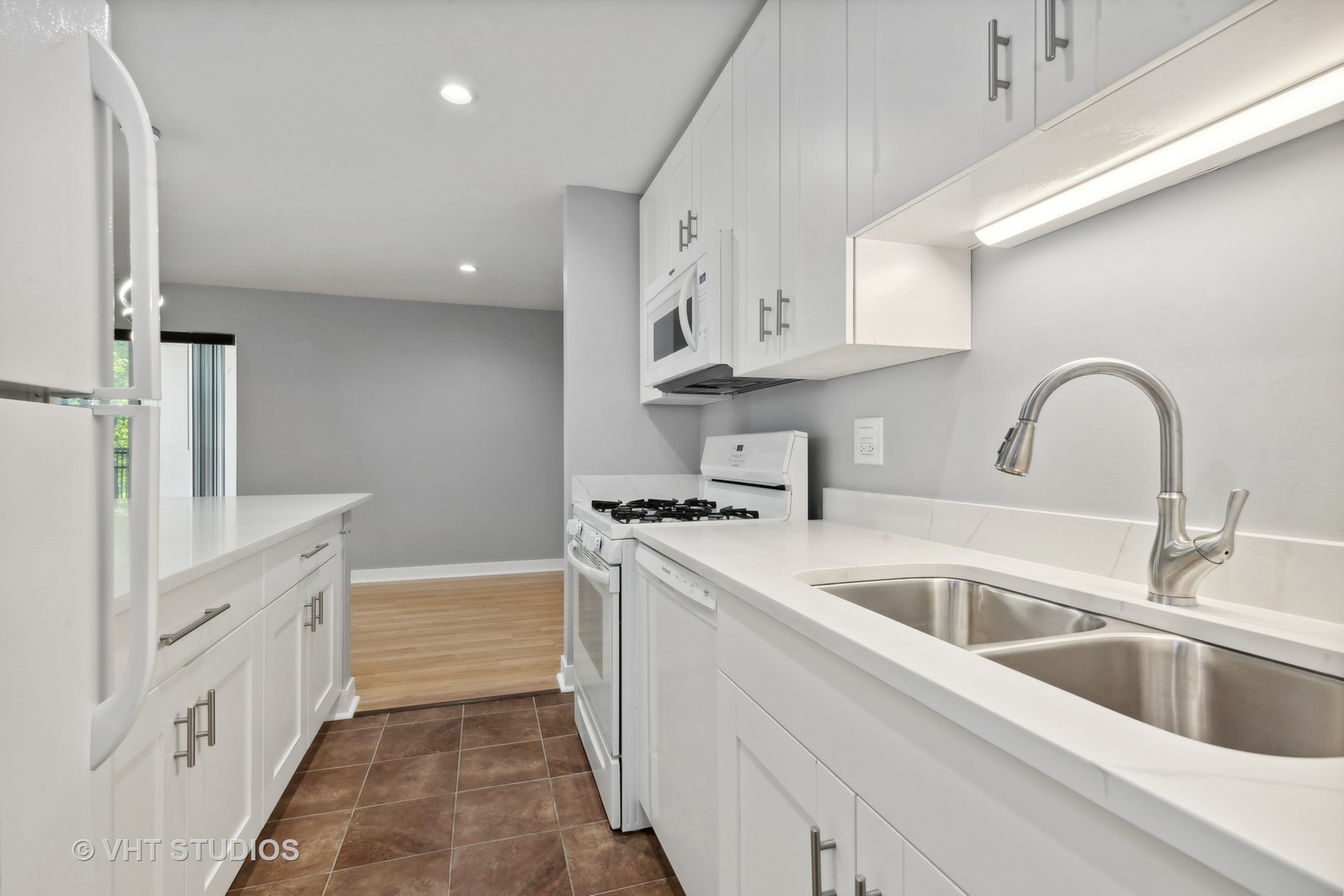 1107 South Old Wilke Road, Unit 205 Rolling Meadows, IL 60008 - Photo 5 of 19 a kitchen with cabinets a sink and appliances