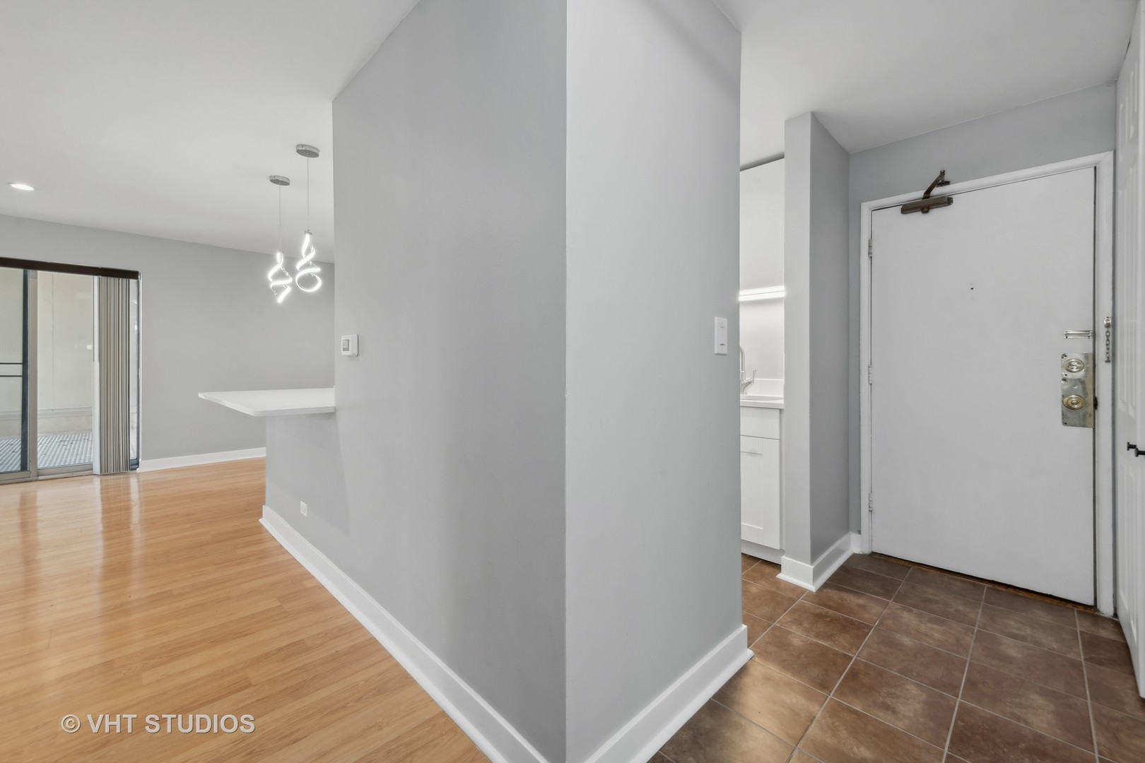 1107 South Old Wilke Road, Unit 205 Rolling Meadows, IL 60008 - Photo 9 of 19 a view of a hallway with wooden floor