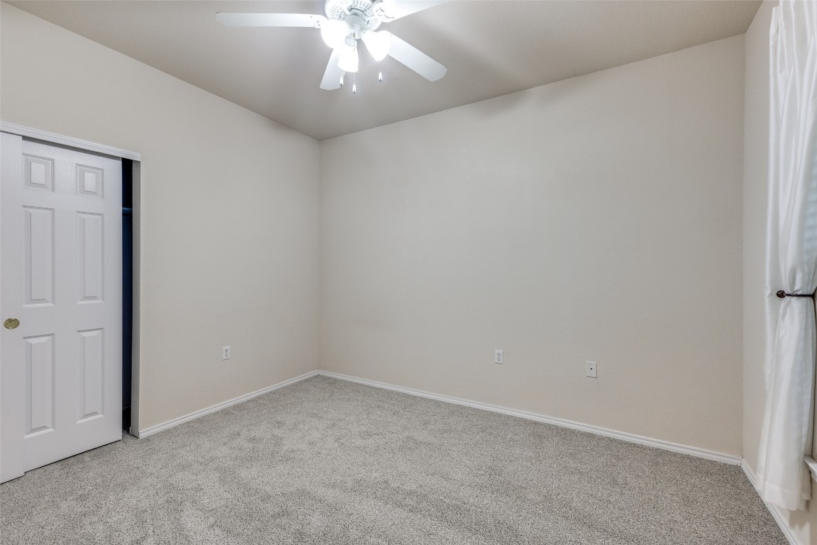 206 Bonham Loop Georgetown, TX 78633 - Photo 14 of 18 an empty room with a chandelier fan