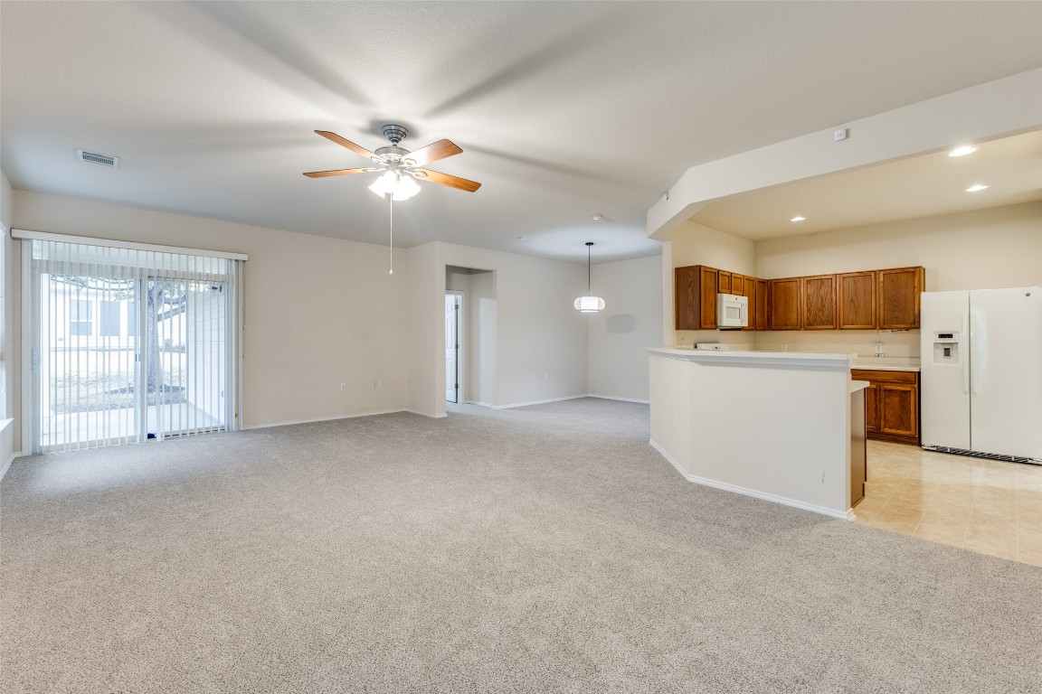 206 Bonham Loop Georgetown, TX 78633 - Photo 5 of 18 a view of a kitchen with a sink and a window