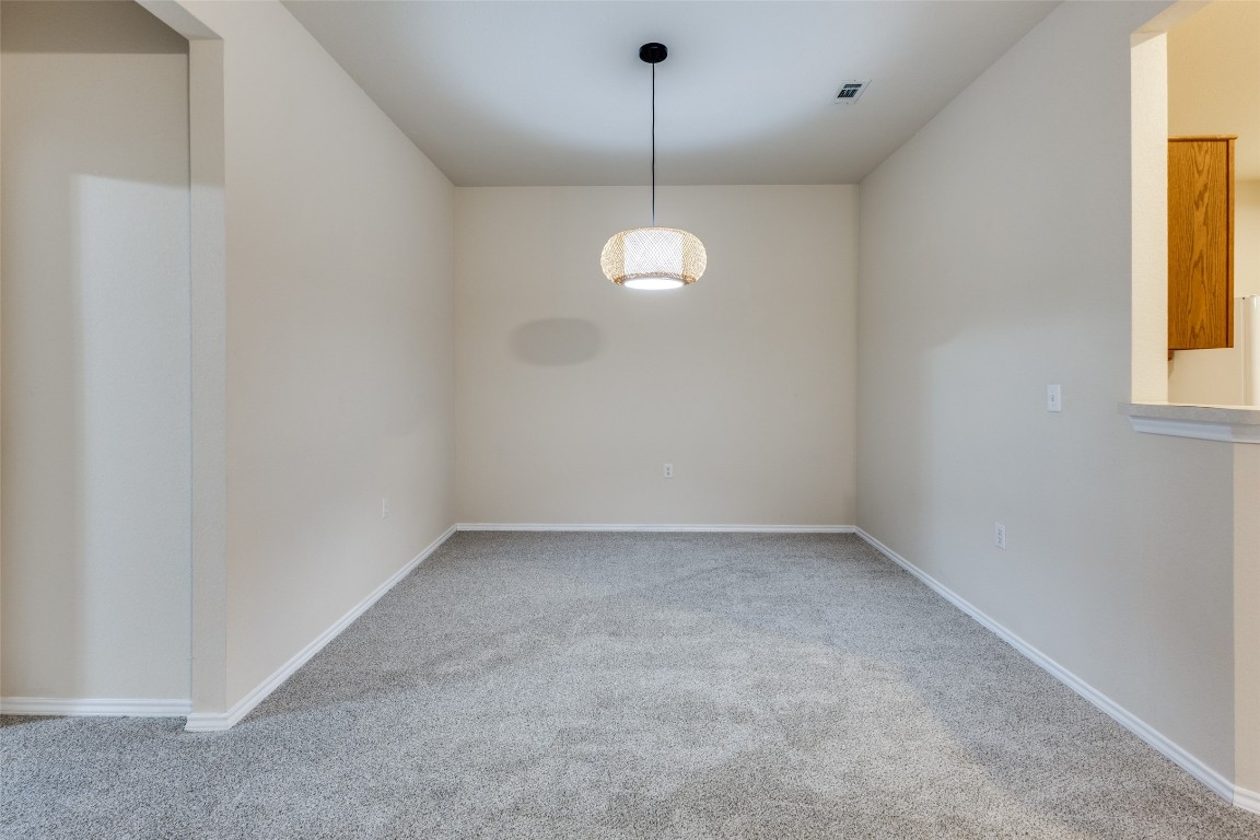 206 Bonham Loop Georgetown, TX 78633 - Photo 7 of 18 a view of an empty room with a window