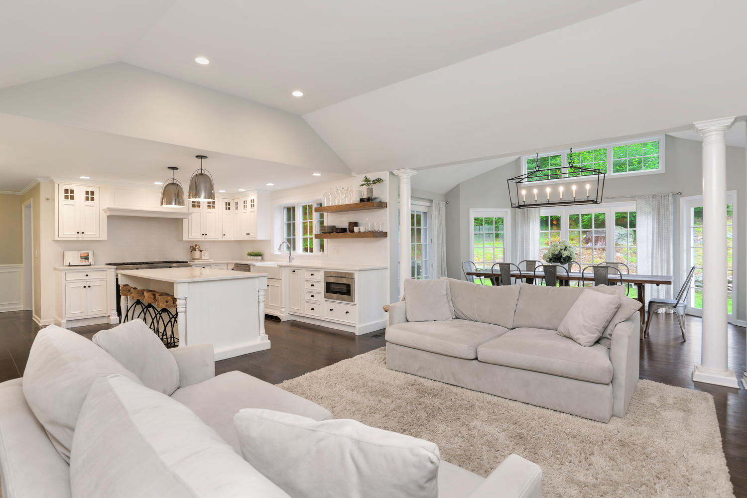 171 Jonathan Road New Canaan, CT 06840 - Photo 12 of 38 a living room with furniture white walls and kitchen view