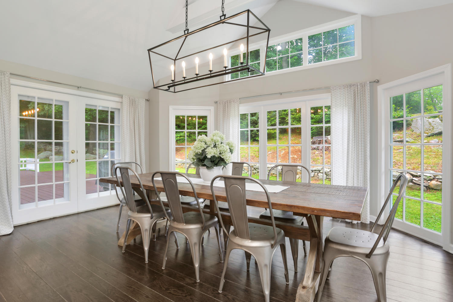 171 Jonathan Road New Canaan, CT 06840 - Photo 16 of 38 a view of a dining room with furniture windows and wooden floor