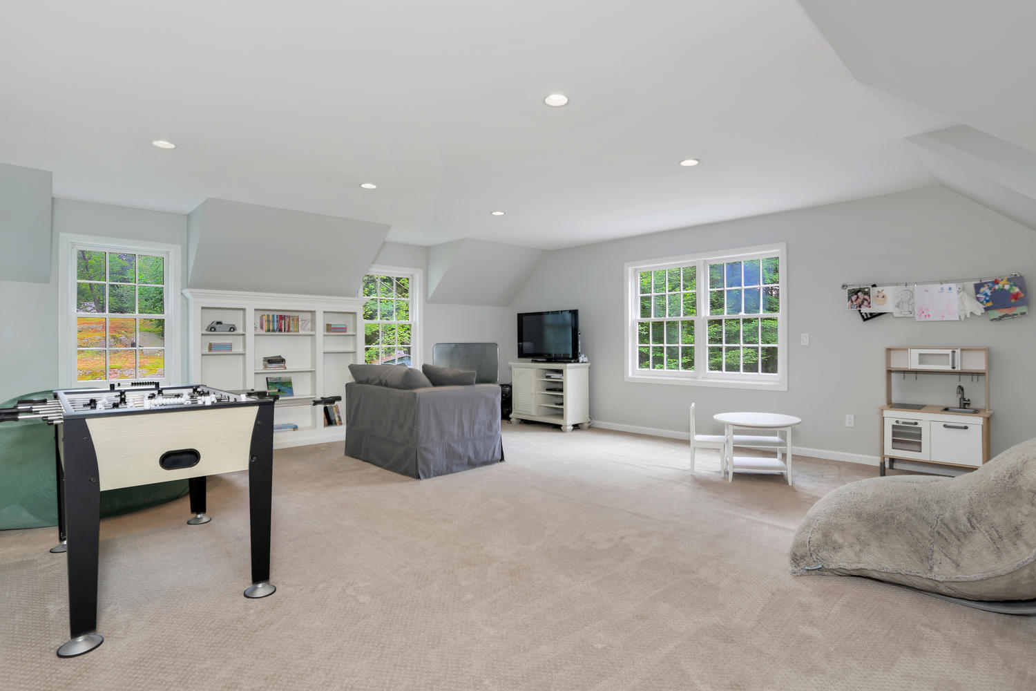 171 Jonathan Road New Canaan, CT 06840 - Photo 19 of 38 a living room with furniture and a large window