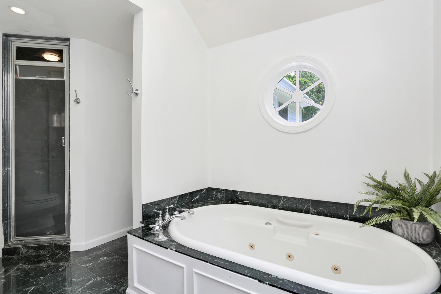 171 Jonathan Road New Canaan, CT 06840 - Photo 25 of 38 a bathroom with a tub and a sink
