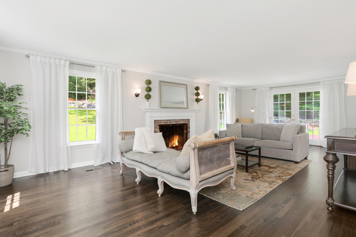 171 Jonathan Road New Canaan, CT 06840 - Photo 4 of 38 a living room with furniture and a fireplace