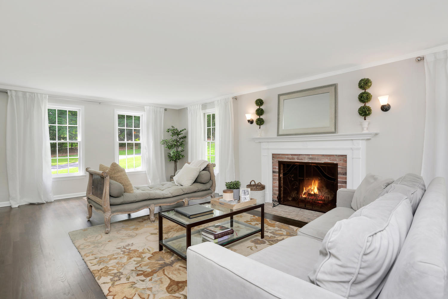 171 Jonathan Road New Canaan, CT 06840 - Photo 6 of 38 a living room with furniture and a fireplace