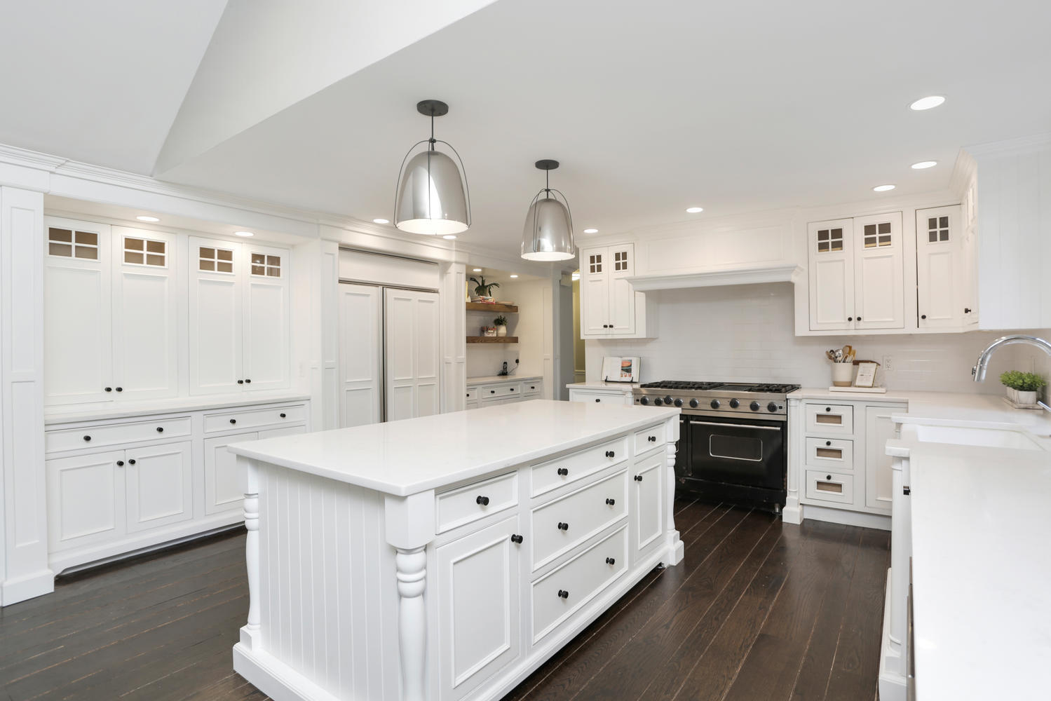 171 Jonathan Road New Canaan, CT 06840 - Photo 10 of 38 a very nice looking kitchen with granite countertop a stove oven a sink dishwasher and white cabinets with wooden floor