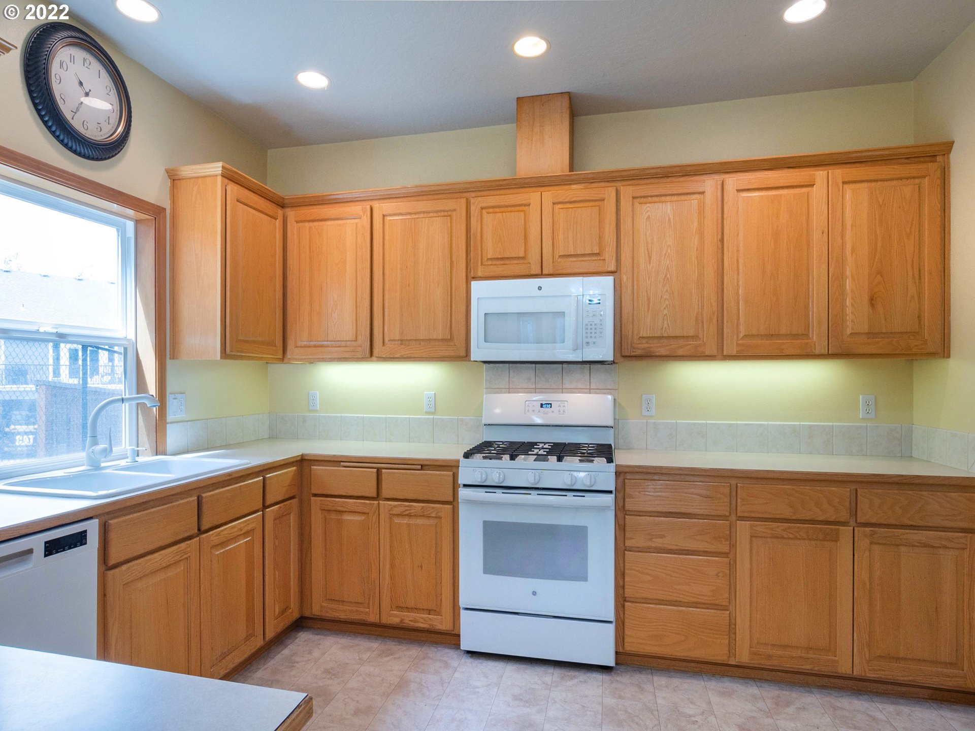 2255 33rd Street Springfield, OR 97477 - Photo 11 of 31 a kitchen with white cabinets and white appliances