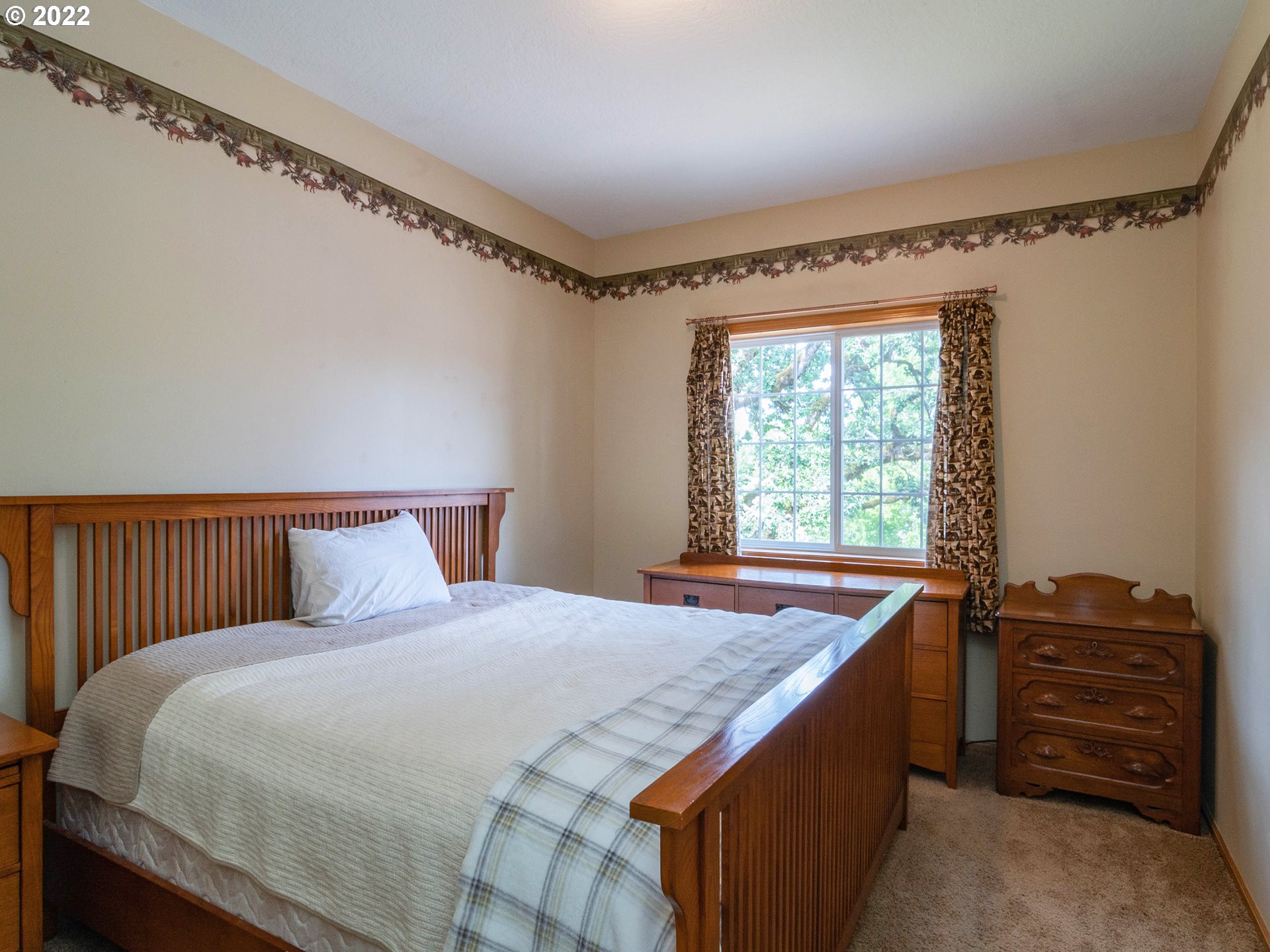 2255 33rd Street Springfield, OR 97477 - Photo 18 of 31 a bedroom with a bed and a window