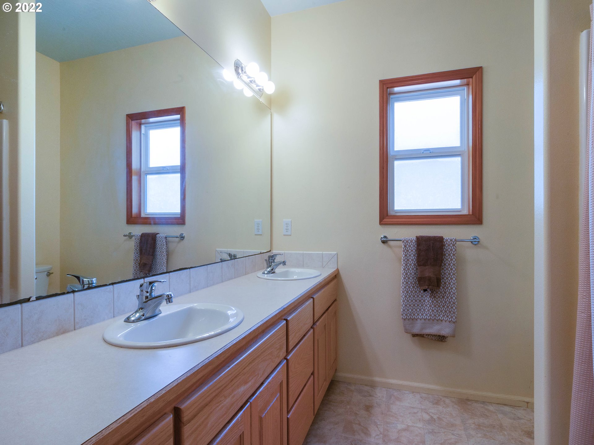 2255 33rd Street Springfield, OR 97477 - Photo 19 of 31 a bathroom with a sink and a mirror