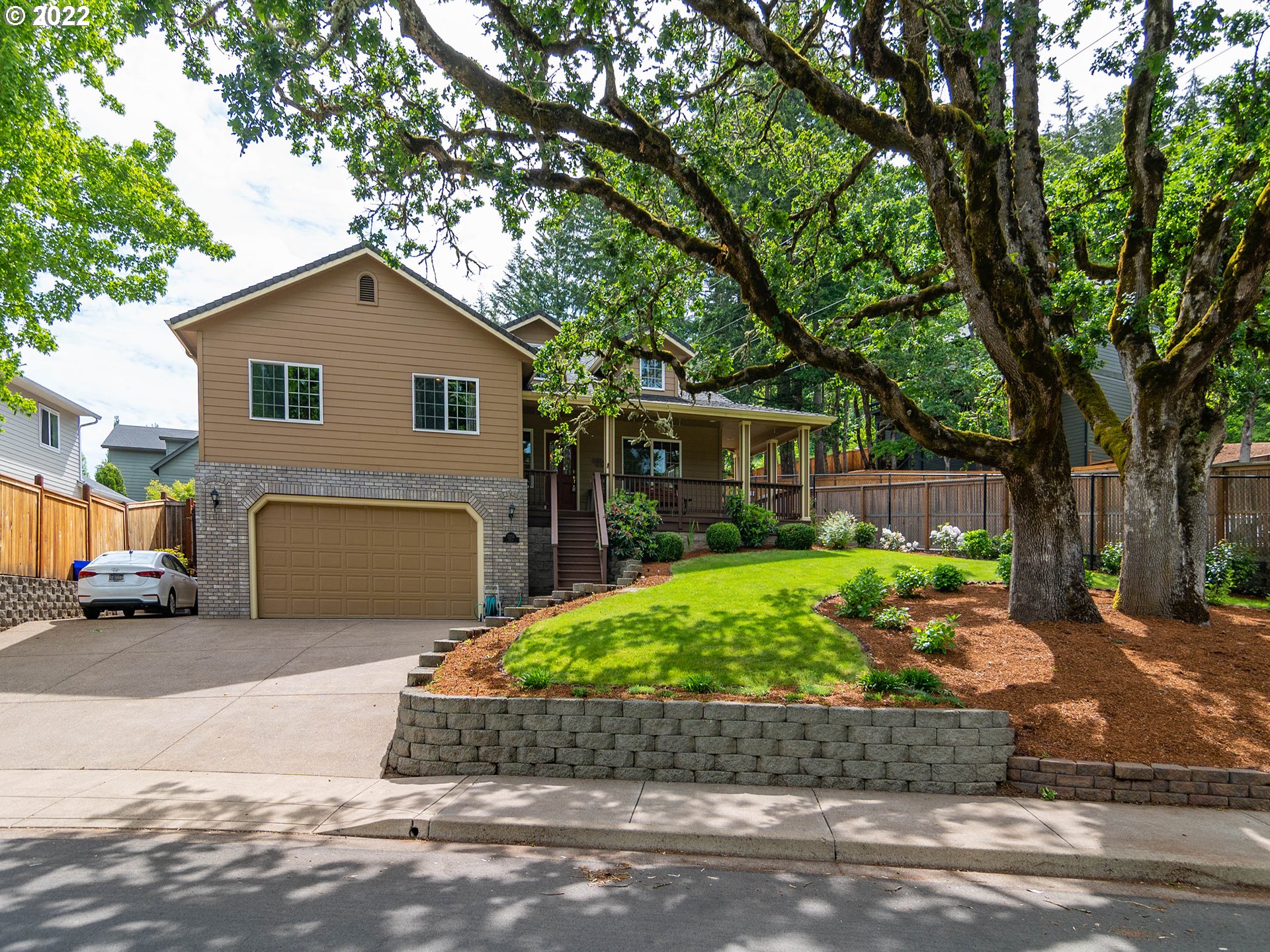 2255 33rd Street Springfield, OR 97477 - Photo 27 of 31 a front view of a house with a garden and outdoor seating