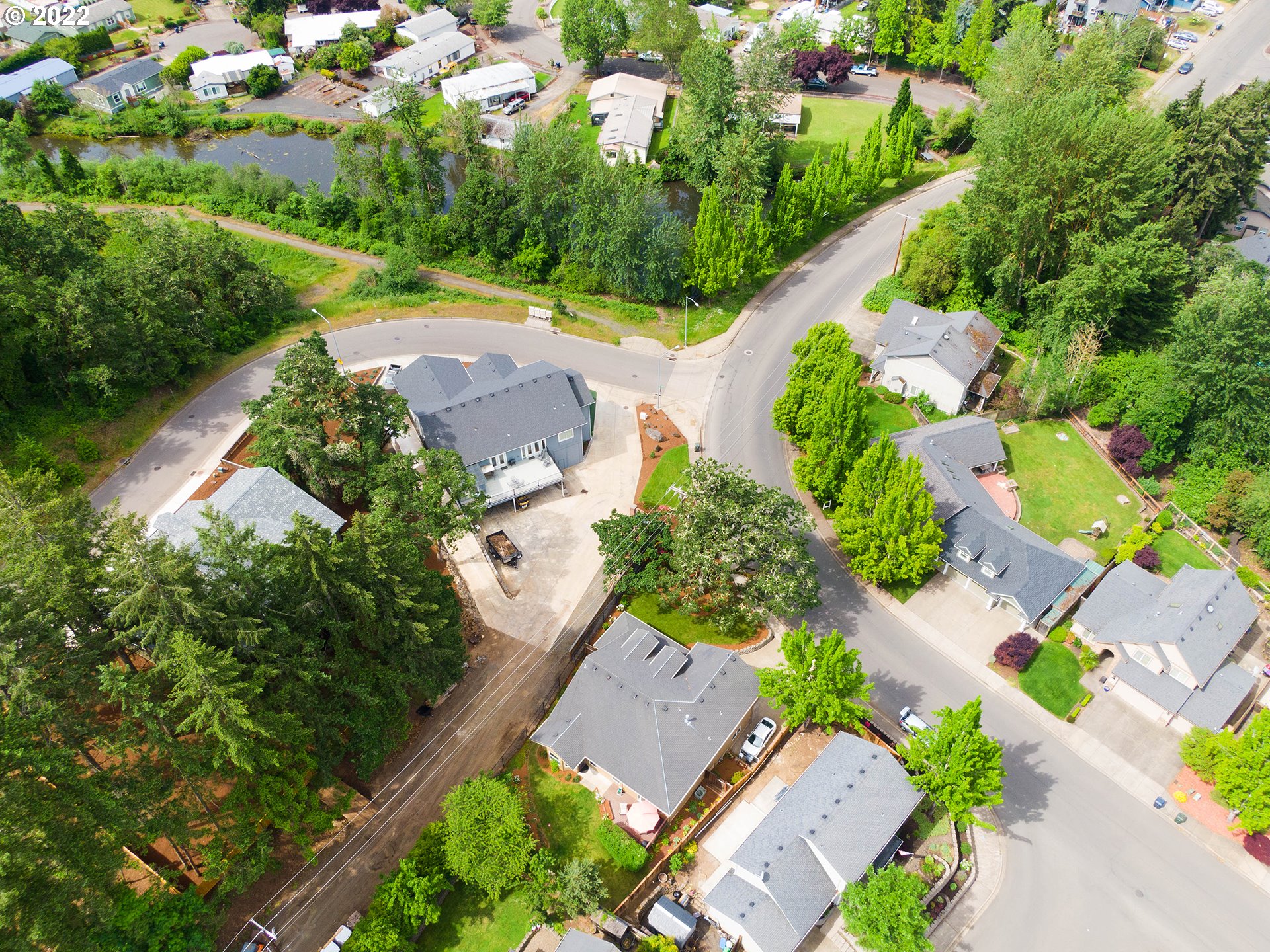 2255 33rd Street Springfield, OR 97477 - Photo 30 of 31 an aerial view of a house with a yard and lake view