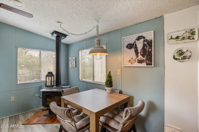 a view of a dining room with furniture window and outside view
