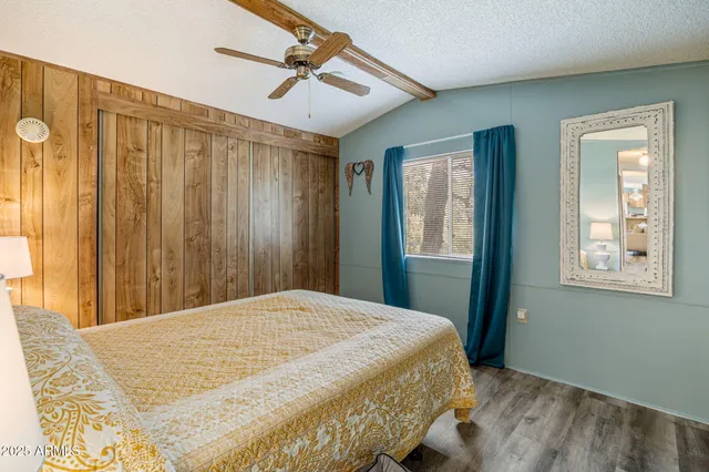 a bedroom with a large bed and a window