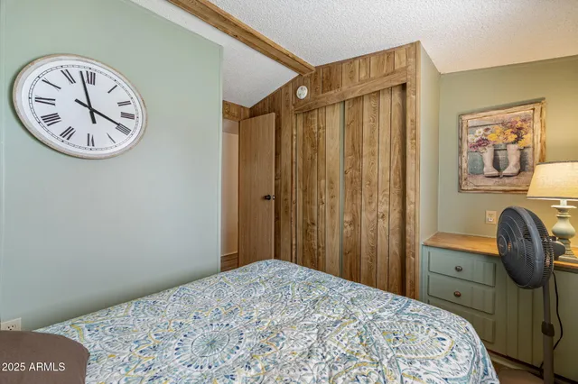 a bedroom with a bed and a closet