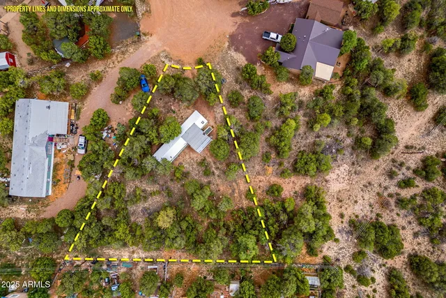 an aerial view of house with yard