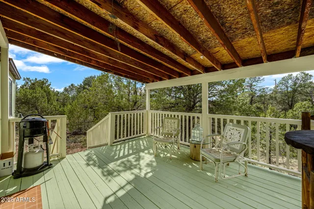 a view of balcony with wooden floor and outdoor seating