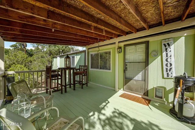 a room with lots of furniture and a large window