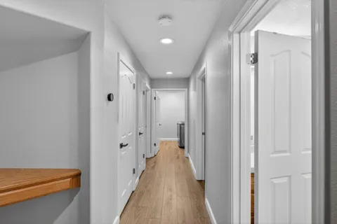 a view of a bathroom from the hallway
