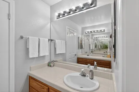 a bathroom with a sink and a mirror